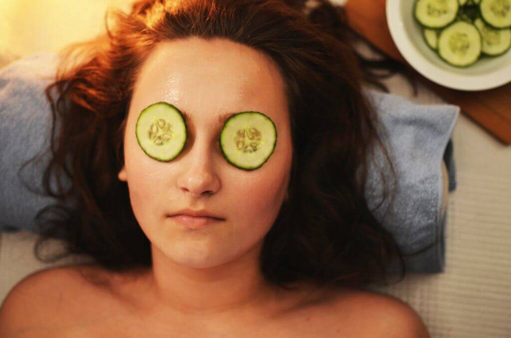 Woman with under-eye patches applied.