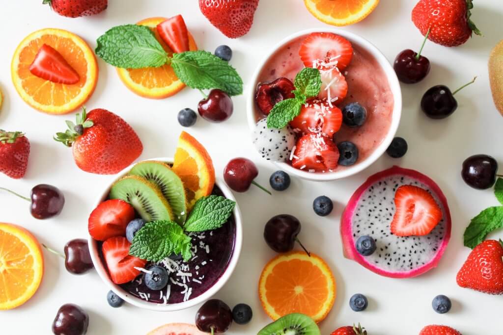 A healthy flat lay of fruits and nuts.