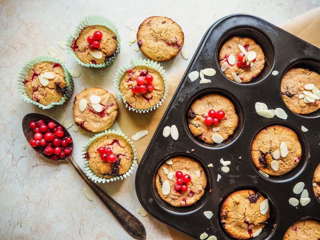 Freshly baked muffins cooling on a wire rack.