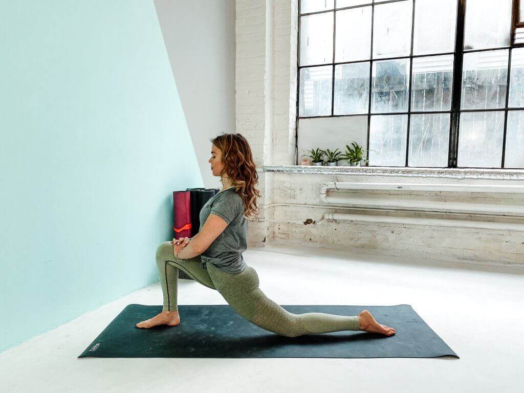 Woman in a Low Lunge, stretching the hips.