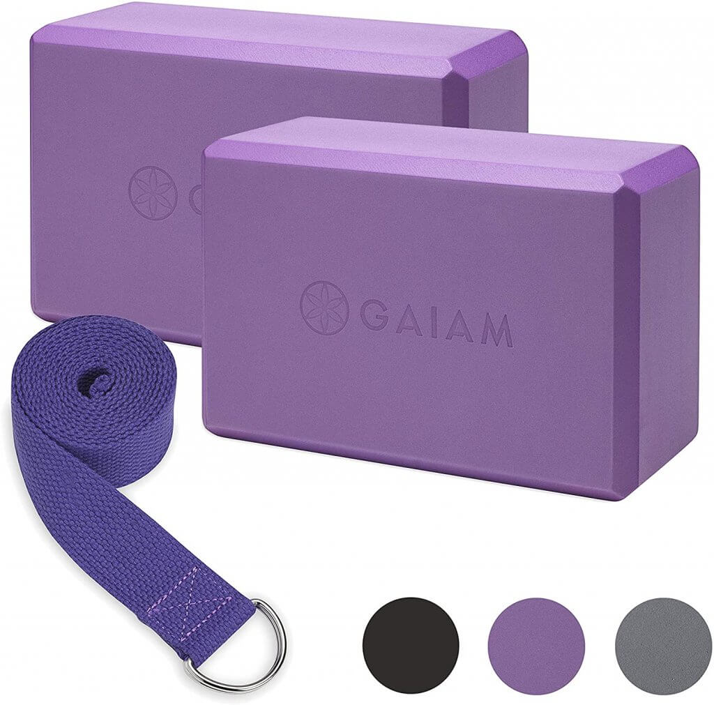 A set of two yoga blocks and a yoga strap.