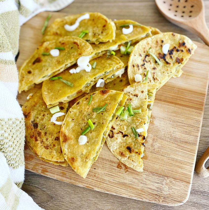 Mini vegan jalapeno popper quesadillas on a plate.